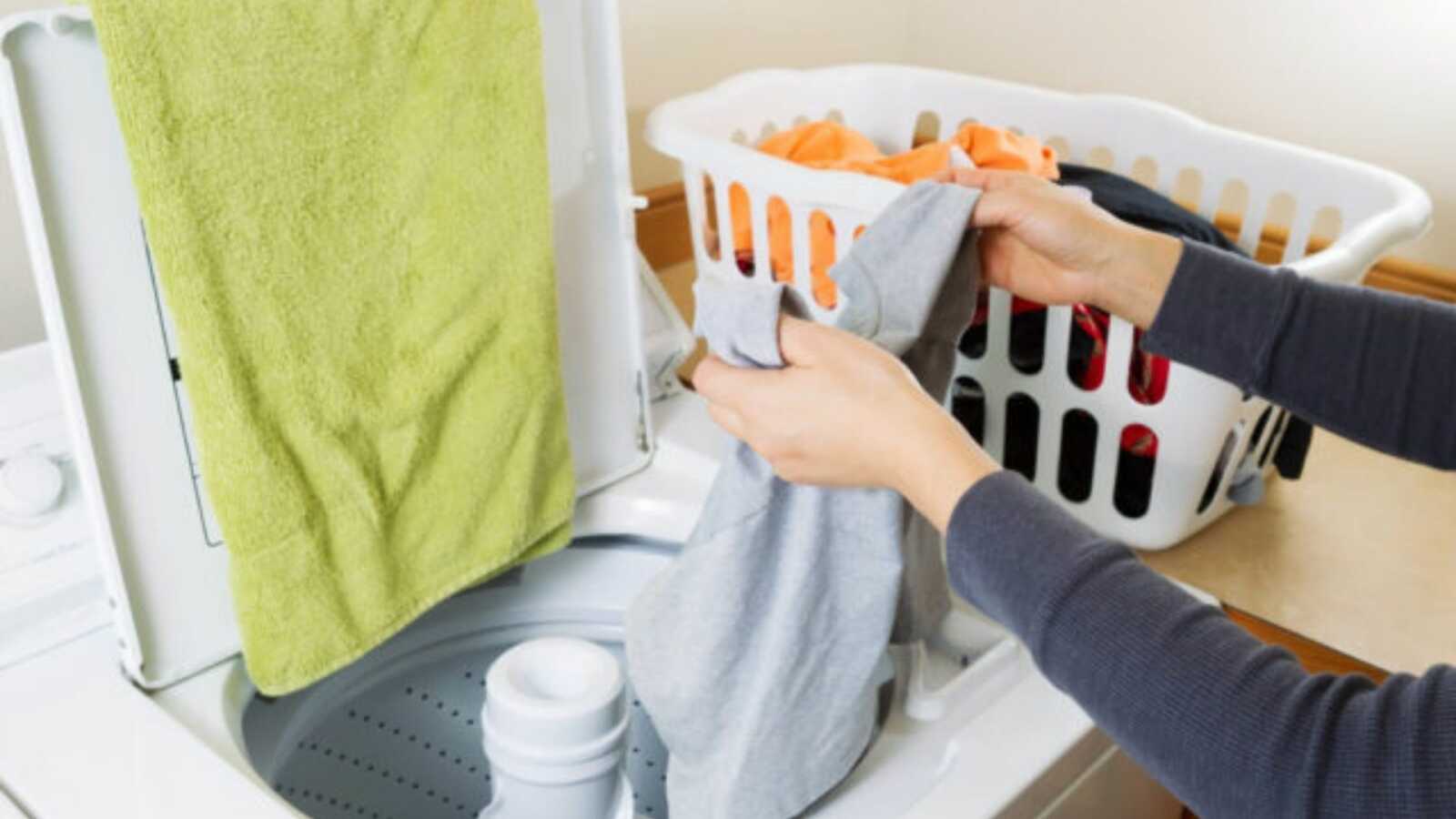 someone doing laundry to help a new mom